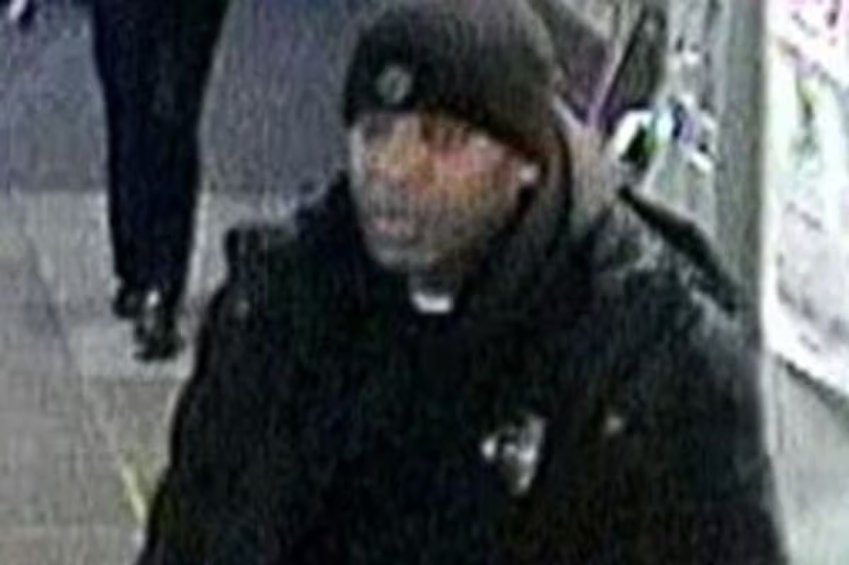 Police hunt thug who punched railway worker at London Underground station