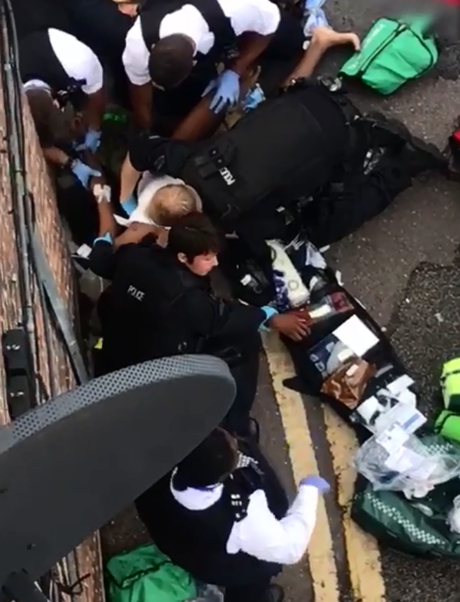 Camberwell stabbing - Harrowing footage shows cops battling to save teens 'disembowelled with a machete' in 30-strong gang fight 'over a belt'
