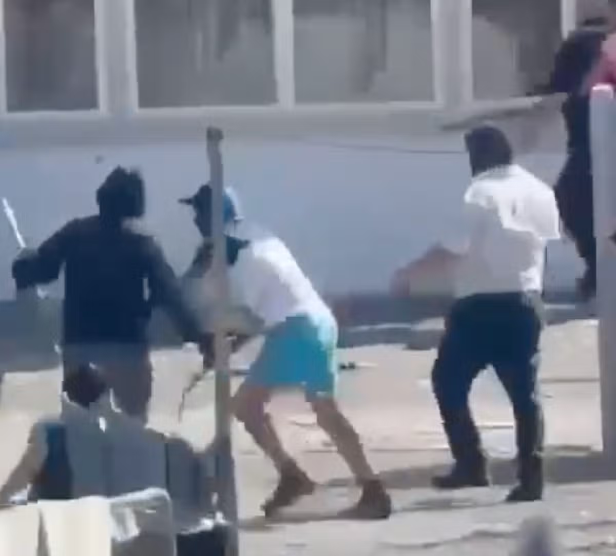 Watch: Masked thugs throw metal bars in Cork riot as two men injured in shooting